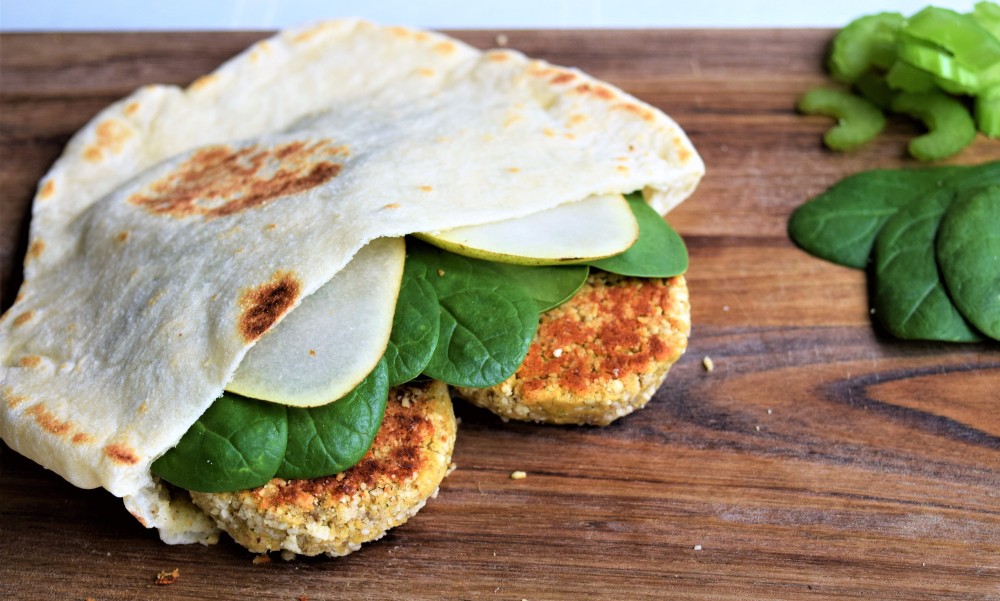 Homemade pita bread with baked falafels and greens